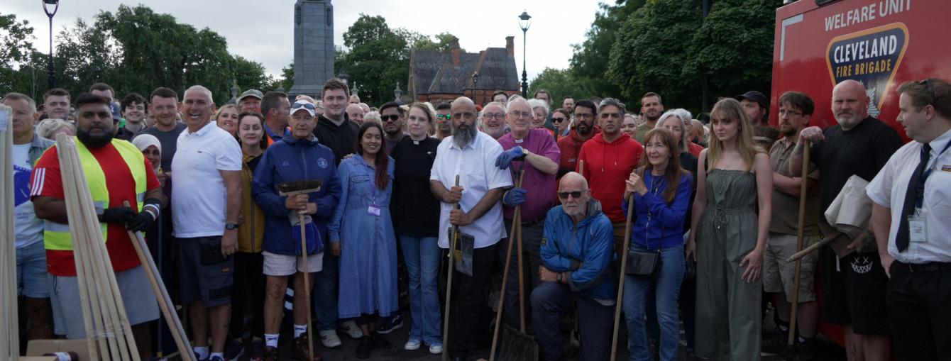 Multiple people stand in solidarity in Middlesborough