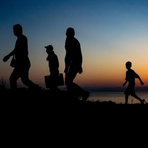 Silhoutte of a group of people walking